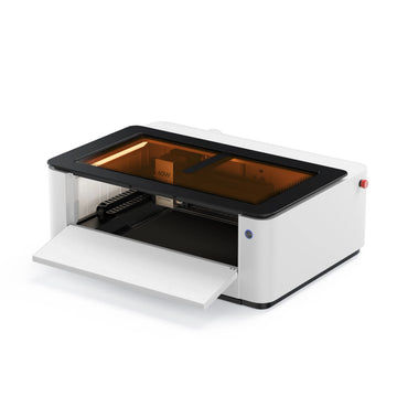 LaserPecker LX2 all-in-one laser cutter with front door open, showing internal workspace