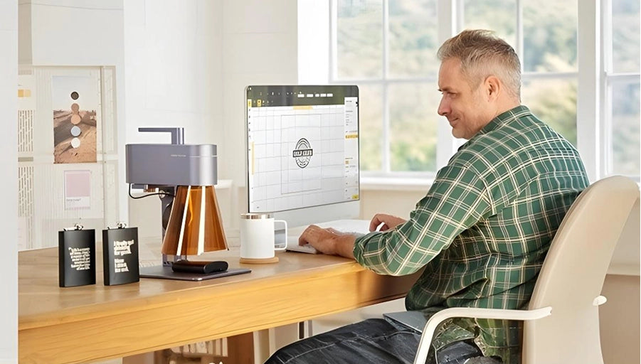 A creator utilizing LaserPecker Design Space LDS software on a desktop PC to edit graphics for laser engraving.