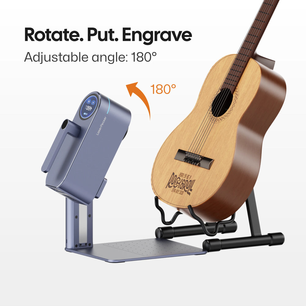 LaserPecker laser engraver with 180° adjustable angle, demonstrating engraving on an acoustic guitar. The headline "Rotate. Put. Engrave" highlights the machine