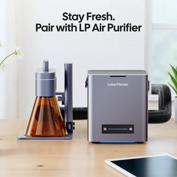 LaserPecker laser engraver for home use, paired with the LP Air Purifier via a hose to remove smoke and fumes, with the slogan “Stay Fresh. Pair with LP Air Purifier”.