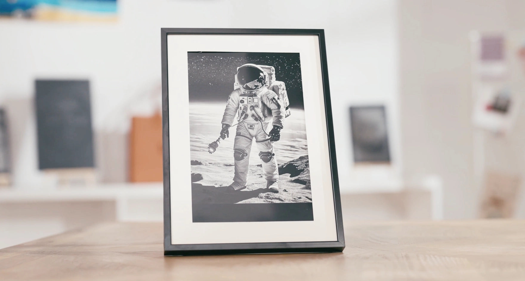 Intricate space theme anodized aluminum desktop plaque featuring a floating astronaut and planets.