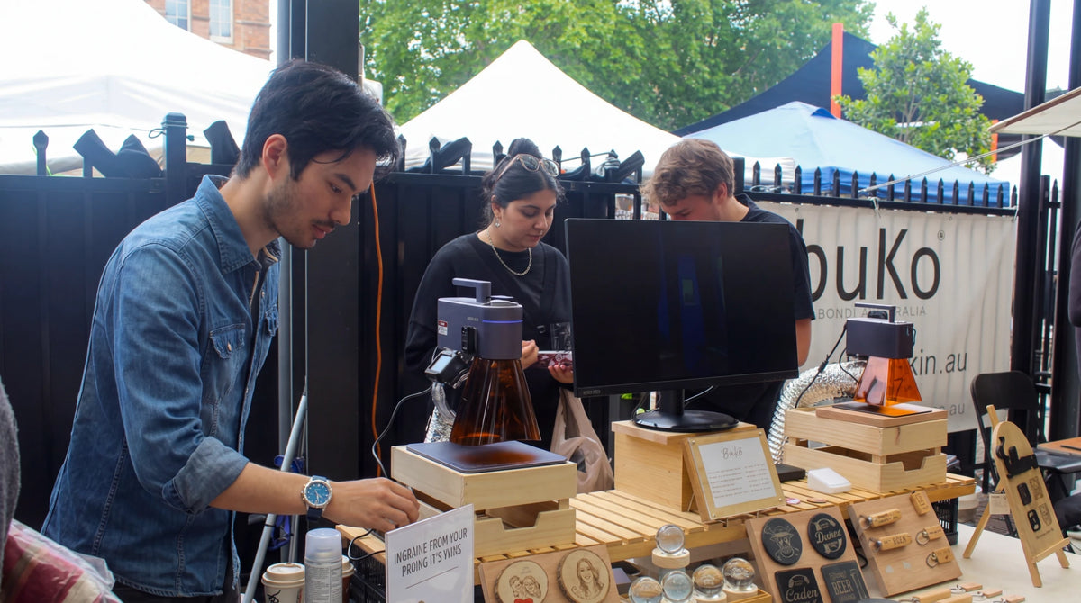 Three vendors demonstrating how to operate the machines.