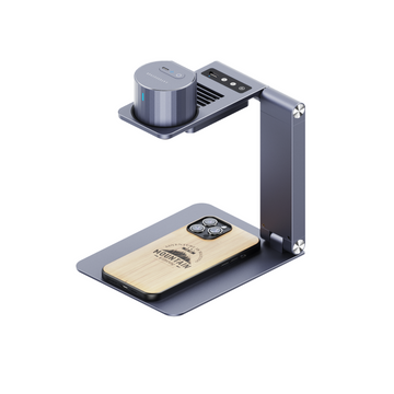 LaserPecker portable engraver mounted on a foldable desktop stand, engraving a "Mountain" design onto a wooden phone case, bundled with a free 3-piece materials kit for immediate use.