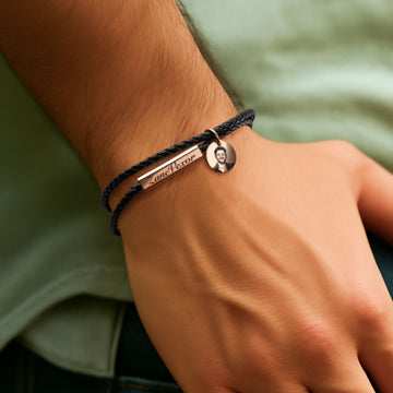 braided leather bracelet with steel rod worn on wrist for laser engraving adjustable fit everyday jewelry.
