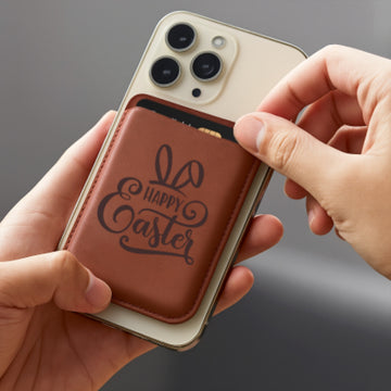 slim, brown faux leather phone wallet, laser-engraved with a festive “Happy Easter” design that includes playful bunny ears and decorative script. Attached to the back of a smartphone, it demonstrates both functionality and personalization, making it a charming, practical gift for the holiday that keeps cards and essentials close at hand.
