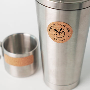 laser engraved round cork labels applied on mason jar lids for rustic pantry organization.