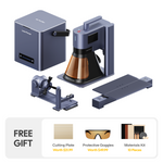 LaserPecker LP5 laser engraver all-in-one bundle: the main fiber laser engraving machine houses a diode laser cutter and is paired with an air purifier, a rotary attachment, and an extended engraving table. Includes a free gift: cutting plate, protective goggles, and a 13-piece materials kit.