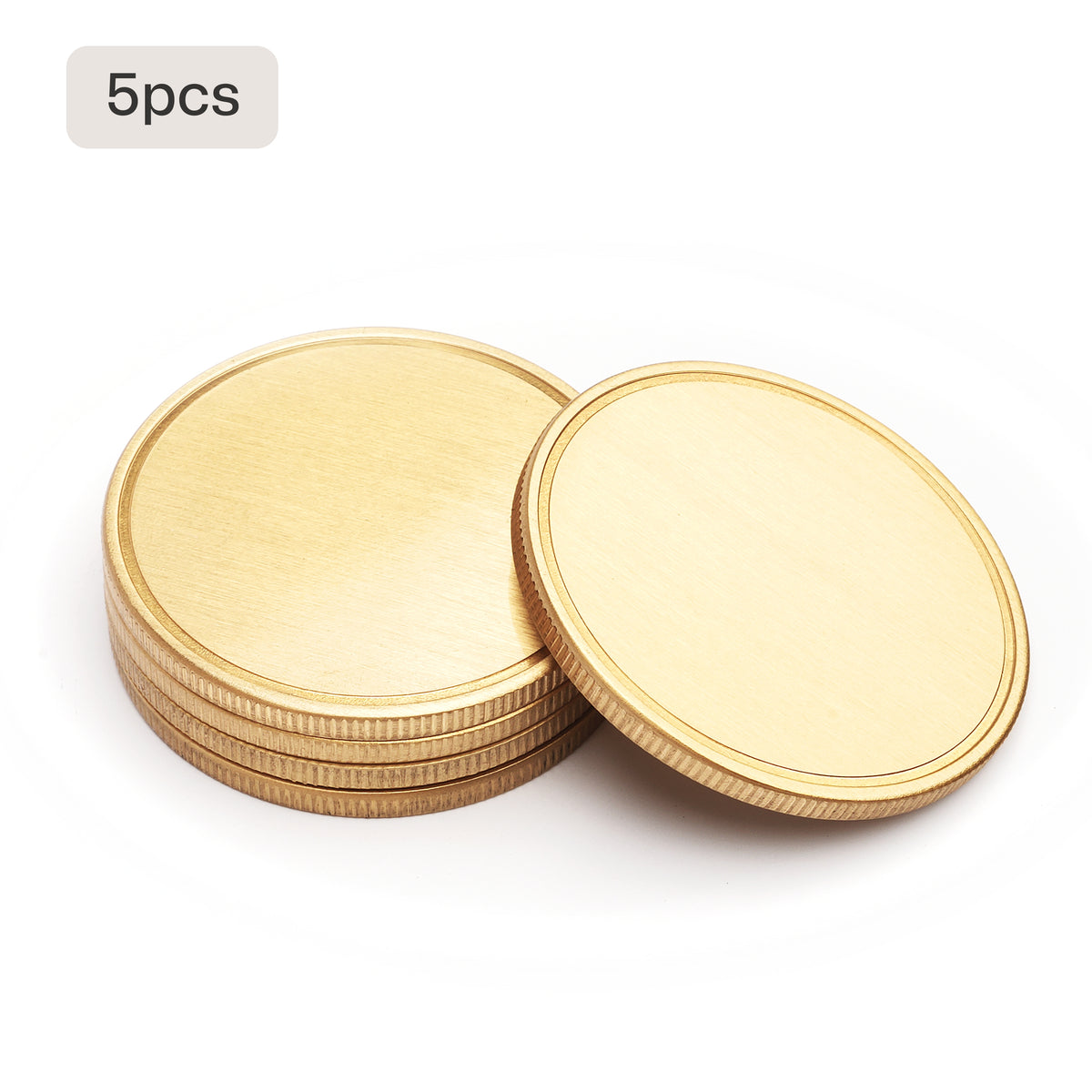 5 blank brass coins stacked for laser engraving bulk order for military units corporate awards.