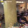 Woman crafting a variety of custom products for customers on-site.